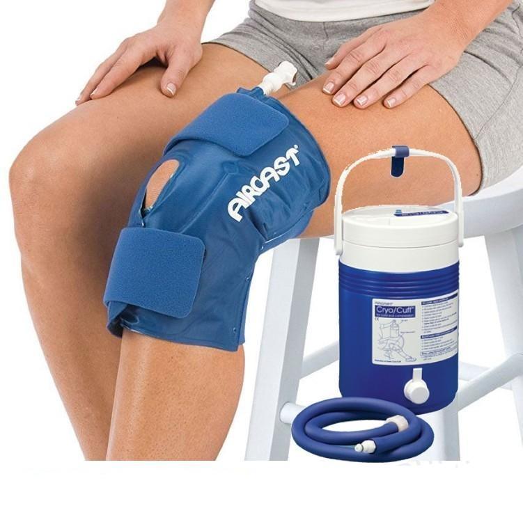 Aircast knee cryo cuff cold therapy system on person's knee with cooler and hose